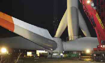 turbine blades being hoisted into position